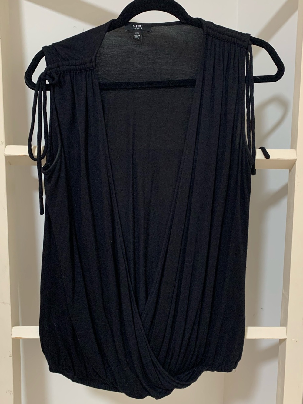 Plunge neck line Black Tie-Shoulder Tank Top - front is open down to the waist.